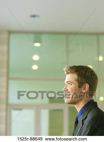 Blond hair, blue eye business man looking forward View Large Photo Image Stock Photo - Blond hair, blue eye business man looking forward. Fotosearch