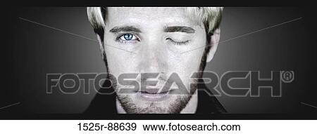 Blond hair man with unshaven face closes one eye and opens up his other blue eye in a surreal pose against a dark background View Large Photo Image Stock Photo - Blond hair man with unshaven face closes one eye and opens up his other blue eye in a surreal pose against a dark background. Fotosearch