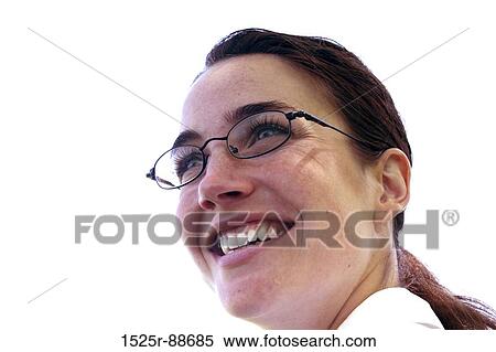 Stock Photography - Business woman in white shirt and glasses smiles with eager pose. Fotosearch