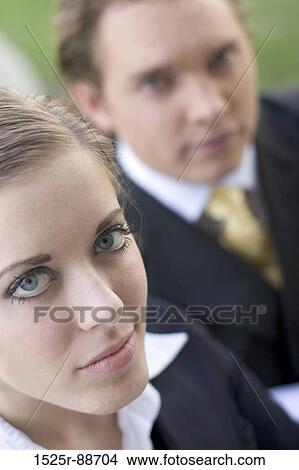 Businesswoman and Businessman close-up looking up at the camera View Large Photo Image Picture - Businesswoman and Businessman close-up looking up at the camera. Fotosearch
