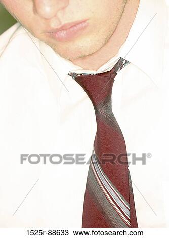 Close-up of the face of a businessman with a white shirt and red tie View Large Photo Image Stock Image - Close-up of the face of a businessman with a white shirt and red tie. Fotosearch