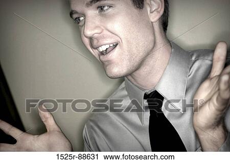 Gray shirted businessman is holding up both his arms in confusion and shrugs View Large Photo Image Stock Image - Gray shirted businessman is holding up both his arms in confusion and shrugs. Fotosearch