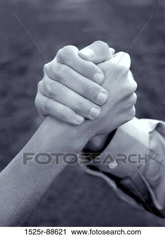Hand of woman and hand of man is clasped together in symbolic strength of unity View Large Photo Image Stock Image - Hand of woman and hand of man is clasped together in symbolic strength of unity. Fotosearch