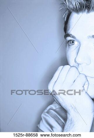 Profile of businessman as he has his hand up next to his chin View Large Photo Image Stock Photo - Profile of businessman as he has his hand up next to his chin. Fotosearch