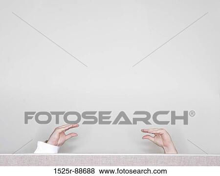 Two hands are talking to each other above a cubical wall with a white background View Large Photo Image Stock Photo - Two hands are talking to each other above a cubical wall with a white background. Fotosearch