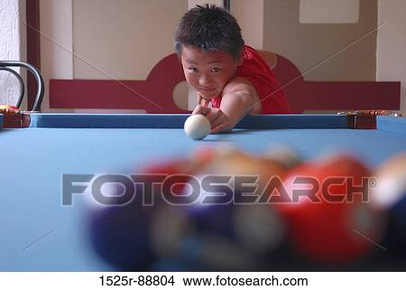 Boy playing billiards View Large Photo Image Picture - Boy playing billiards. Fotosearch