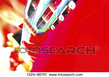 Close-up of a person playing a guitar View Large Photo Image Stock Photo - Close-up of a person playing a guitar. Fotosearch