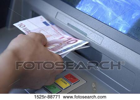 Close-up of a person's hand collecting euro banknotes from an ATM View Large Photo Image Stock Image - Close-up of a person's hand collecting euro banknotes from an ATM. Fotosearch