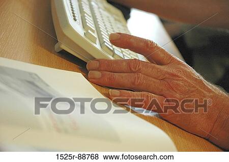 Close-up of a senior man's hands using a computer keyboard View Large Photo Image Stock Photo - Close-up of a senior man's hands using a computer keyboard. Fotosearch