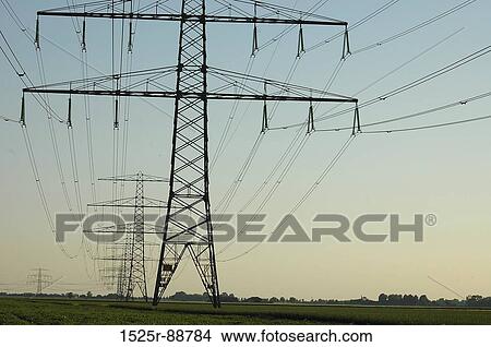 Electricity pylons on a landscape View Large Photo Image Picture - Electricity pylons on a landscape. Fotosearch