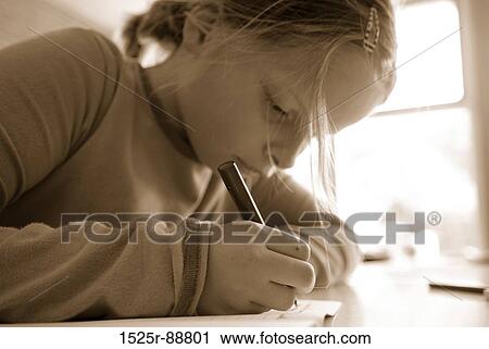 Girl writing in a notebook View Large Photo Image Stock Image - Girl writing in a notebook. Fotosearch