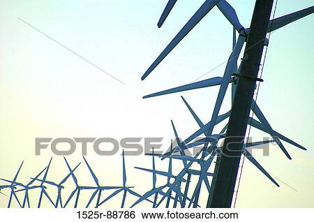 Low angle view of wind turbines View Large Photo Image Stock Photograph - Low angle view of wind turbines. Fotosearch