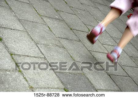 Low section view of a girl jumping View Large Photo Image Stock Photo - Low section view of a girl jumping. Fotosearch