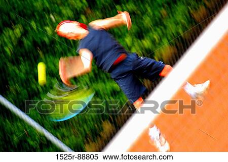 Man playing tennis on a tennis court View Large Photo Image Stock Photography - Man playing tennis on a tennis court. Fotosearch