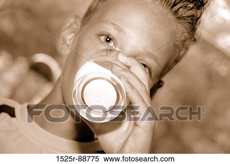 Portrait of a boy drinking milk View Large Photo Image Stock Photography - Portrait of a boy drinking milk. Fotosearch