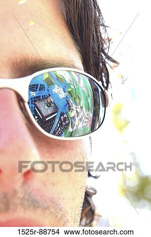 Reflection of graffiti in the sunglasses of a young man View Large Photo Image Picture - Reflection of graffiti in the sunglasses of a young man. Fotosearch
