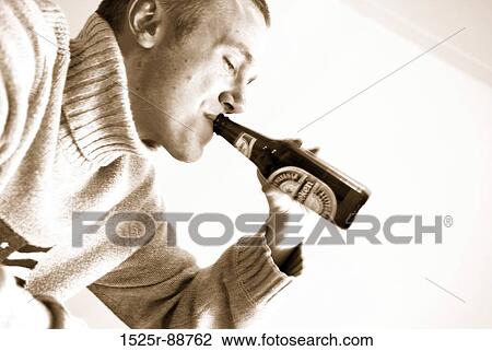 Young man drinking beer View Large Photo Image Stock Image - Young man drinking beer. Fotosearch