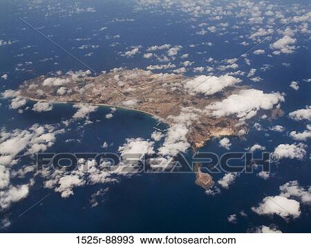 Stock Image - Aerial view of clouds over an island. Fotosearch