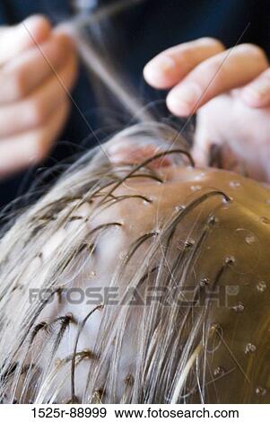 Close-up of a person highlighting hair View Large Photo Image Stock Photo - Close-up of a person highlighting hair. Fotosearch