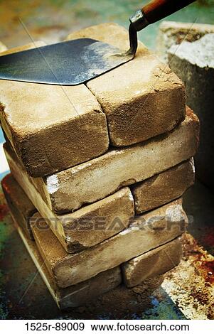 Close-up of a trowel on a stack of bricks View Large Photo Image Stock Photo - Close-up of a trowel on a stack of bricks. Fotosearch