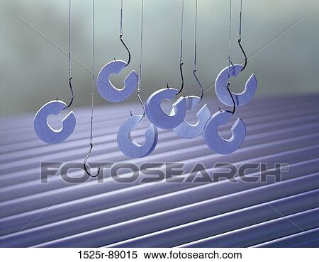Stock Photography - Close-up of the letter C hanging on fishing hooks. Fotosearch