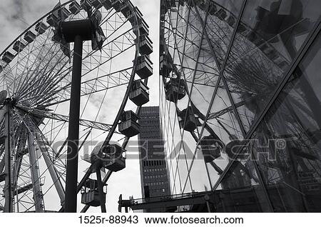 Reflection of a ferris wheel on the glass of a building View Large Photo Image Stock Image - Reflection of a ferris wheel on the glass of a building. Fotosearch