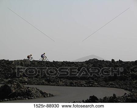 Two people mountain biking View Large Photo Image Stock Image - Two people mountain biking. Fotosearch