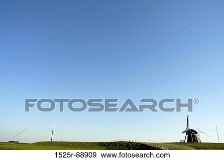 Traditional windmill in a field View Large Photo Image Stock Photo - Traditional windmill in a field. Fotosearch