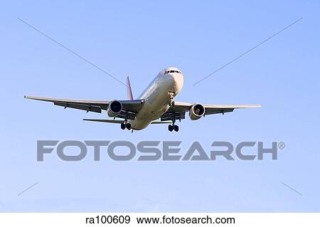 Stock Photo - Airplane in flight. Fotosearch