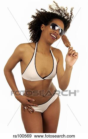 Bikini girl with lolly View Large Photo Image Stock Photo - Bikini girl with lolly. Fotosearch