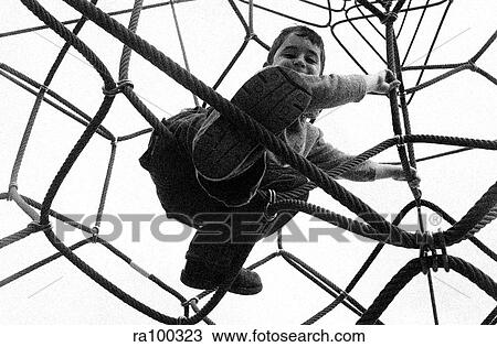 Boy climbing View Large Photo Image Stock Image - Boy climbing. Fotosearch