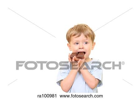 Boy eating chocolat View Large Photo Image Stock Image - Boy eating chocolat. Fotosearch