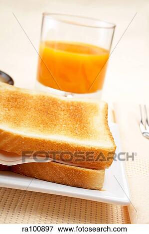 Breakfast toast and orange View Large Photo Image Stock Photo - Breakfast toast and orange. Fotosearch