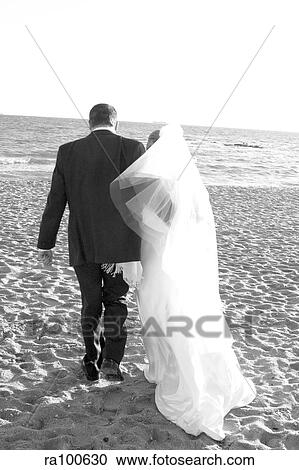 Bride and grrom on beach View Large Photo Image Stock Image - Bride and grrom on beach. Fotosearch