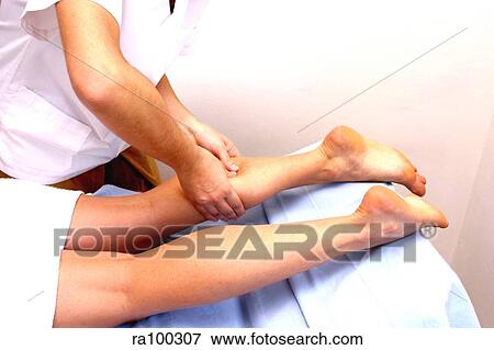 Calf muscle massage View Large Photo Image Stock Photo - Calf muscle massage. Fotosearch