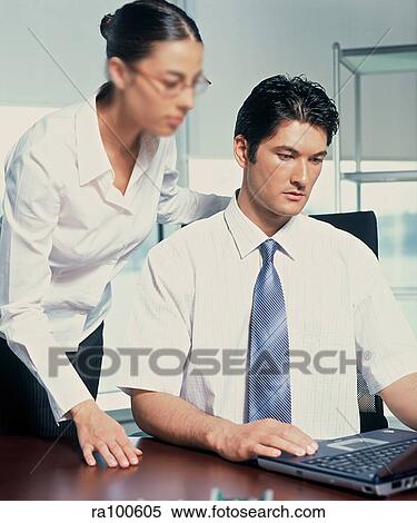 Stock Photography - Colleagues working together. Fotosearch
