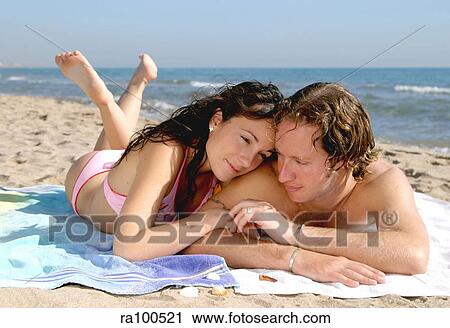 Couple on the beach View Large Photo Image Stock Image - Couple on the beach. Fotosearch