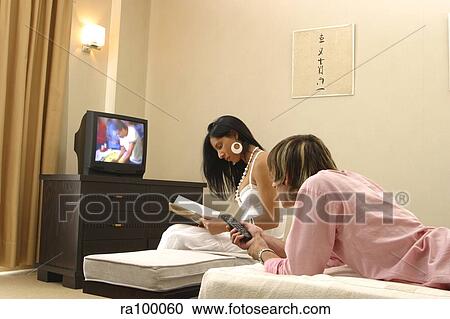 Couple watching TV View Large Photo Image Stock Image - Couple watching TV. Fotosearch