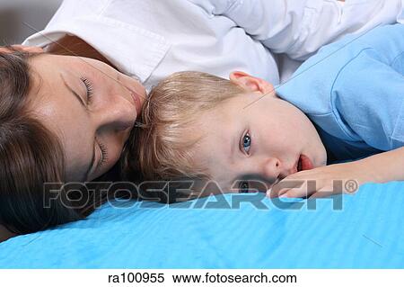 Family in bed together View Large Photo Image Stock Photography - Family in bed together. Fotosearch
