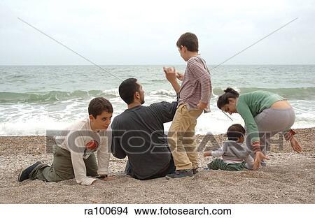 Family on beach View Large Photo Image Picture - Family on beach. Fotosearch