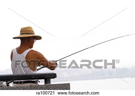 Stock Image - Fishing alone. Fotosearch