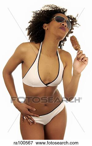 Girl in bikini with lolloy View Large Photo Image Stock Photo - Girl in bikini with lolloy. Fotosearch
