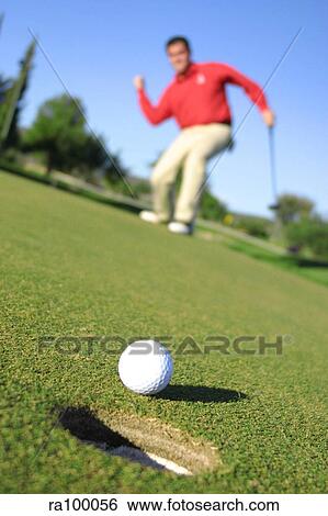 Golf ball at hole View Large Photo Image Stock Photograph - Golf ball at hole. Fotosearch