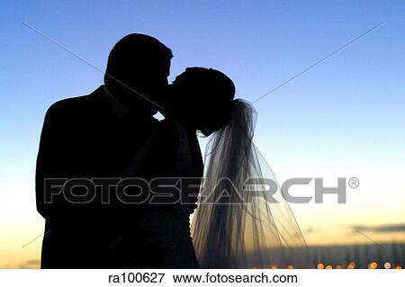 Stock Photo - Kissing bride and groom. Fotosearch