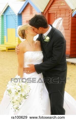 Stock Photo - Kissing bride and groom. Fotosearch