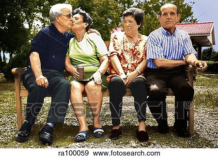 Stock Photo - Older people on bench. Fotosearch