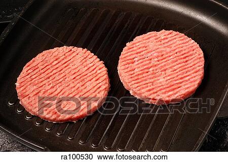 Stock Image - Raw burgers. Fotosearch