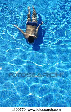 Swimming underwater View Large Photo Image Stock Image - Swimming underwater. Fotosearch