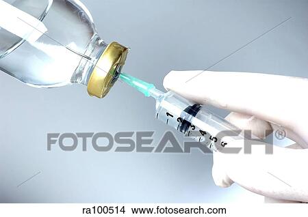 Syringe and bottle View Large Photo Image Picture - Syringe and bottle. Fotosearch