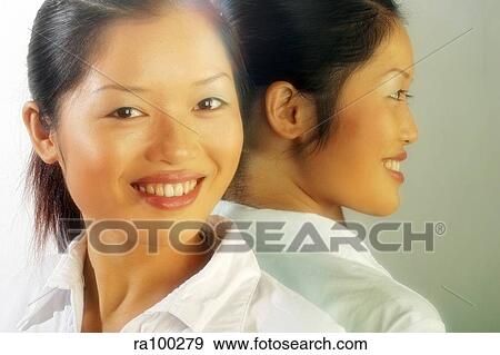 Two Asian faces View Large Photo Image Stock Photo - Two Asian faces. Fotosearch